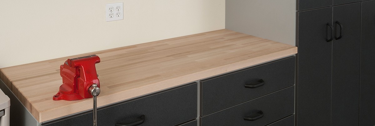 Sturdy workbench with cabinets for storage.