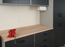 Sturdy workbench with cabinets for storage.