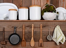 Kitchen utensils neatly handing from wall