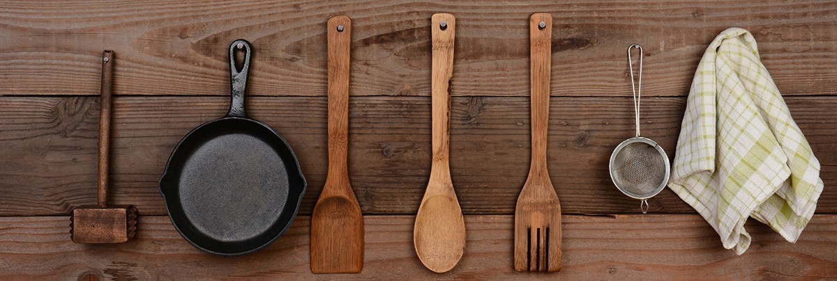Kitchen utensils neatly handing from wall