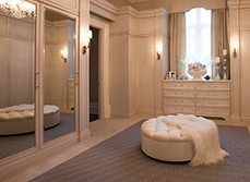 Sofa in the middle of a spacious walk-in wardrobe