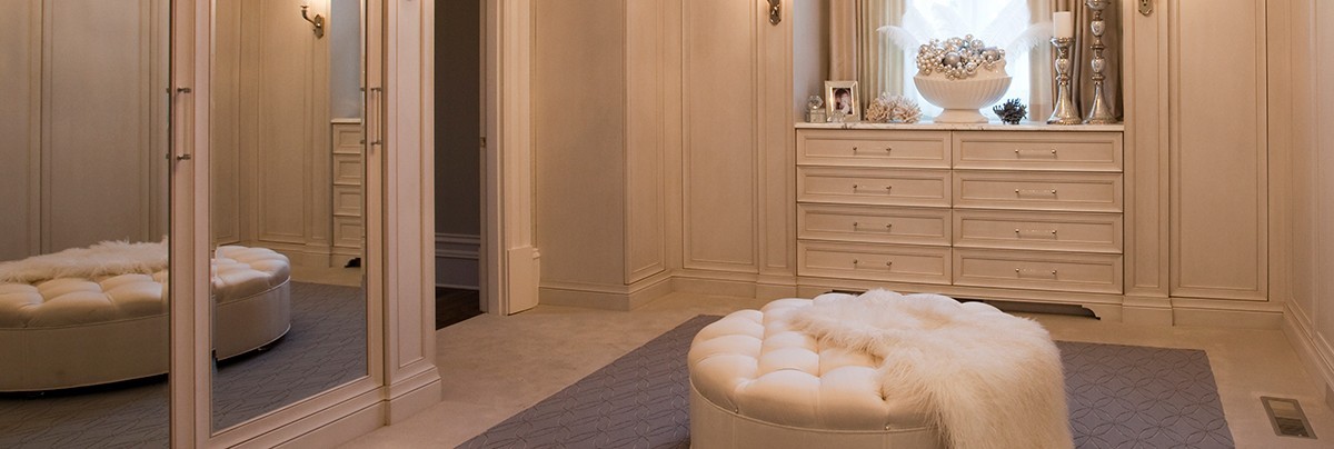 Sofa in the middle of a spacious walk-in wardrobe