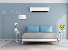 Modern, stylish and minimalist bedroom with an air conditioning system