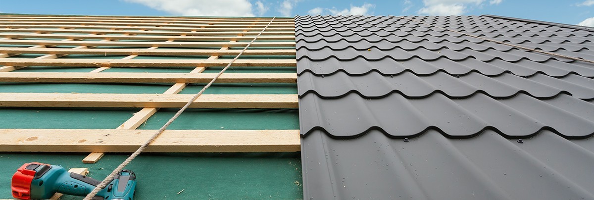 Corrugated iron roof being installed