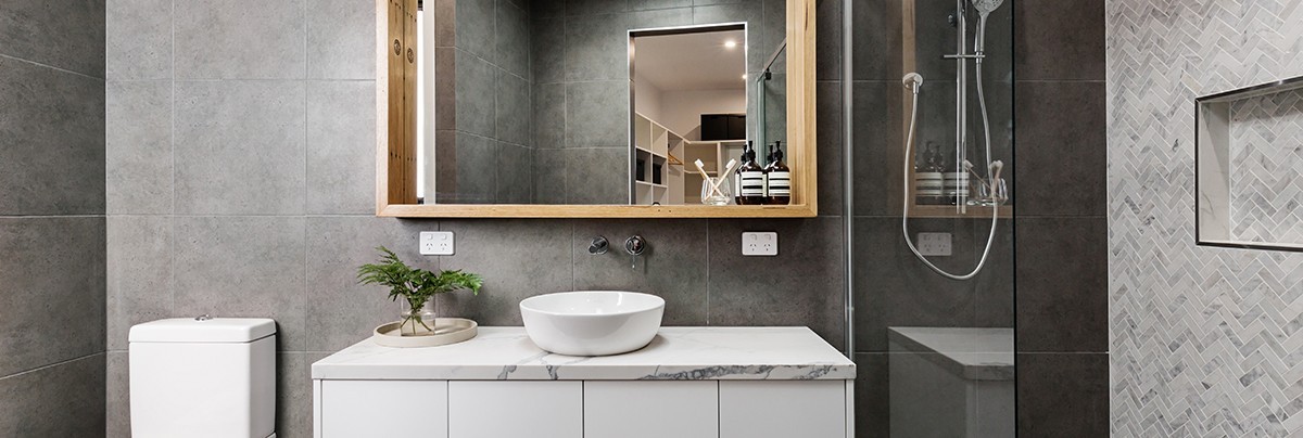 A modernist bathroom with grey tiling