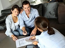 Couple looking over detailed home renovation plan.