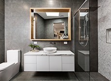 A modernist bathroom with grey tiling