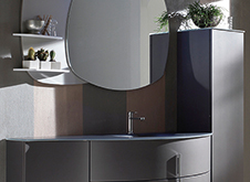 Grafite Metallizzato colour and finish vanity with glass countertop, the horizontal drawers and one vertical drawer.