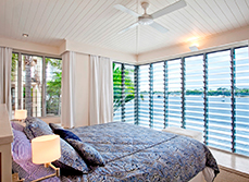 Breezeway Louvre window in white double bedroom, facing the bay.