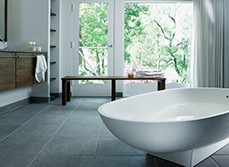 bathroom with grey tiles flooring