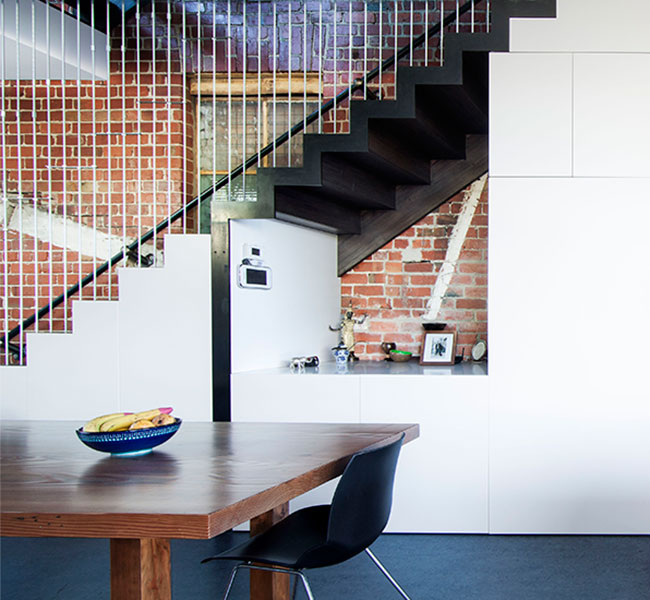 Side view of converted residential kitchen and stairwell