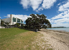 house built with a flat roof on the coast