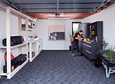 A garage with carefully planned storage and workspace