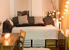 A bedroom with decorating lights