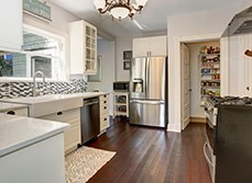 a kitchen with build in storage