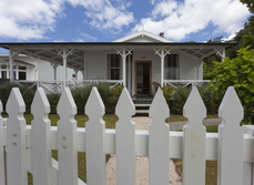 New Zealand house with white picket fence