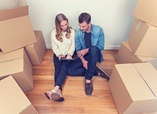 Couple moving in to rental house and looking up renovation options online