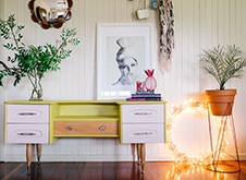 Chest of drawers revamped with pastel purple drawers and yellow green body using Chalk Paint.