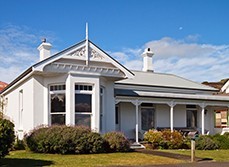 house in new zealand under blue sky