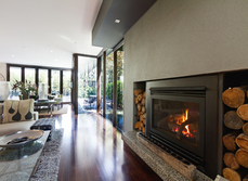 A log burning fire place in a modern living space