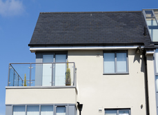 A semi-detached property with raised balcony