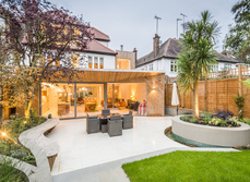 A large garden living space added on to a home and terrace area.