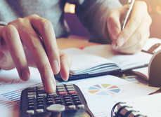 A person working on a calculator