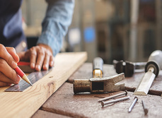 A carpenter working and his tools