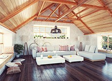 Modern loft shows living room ventilated with three large windows