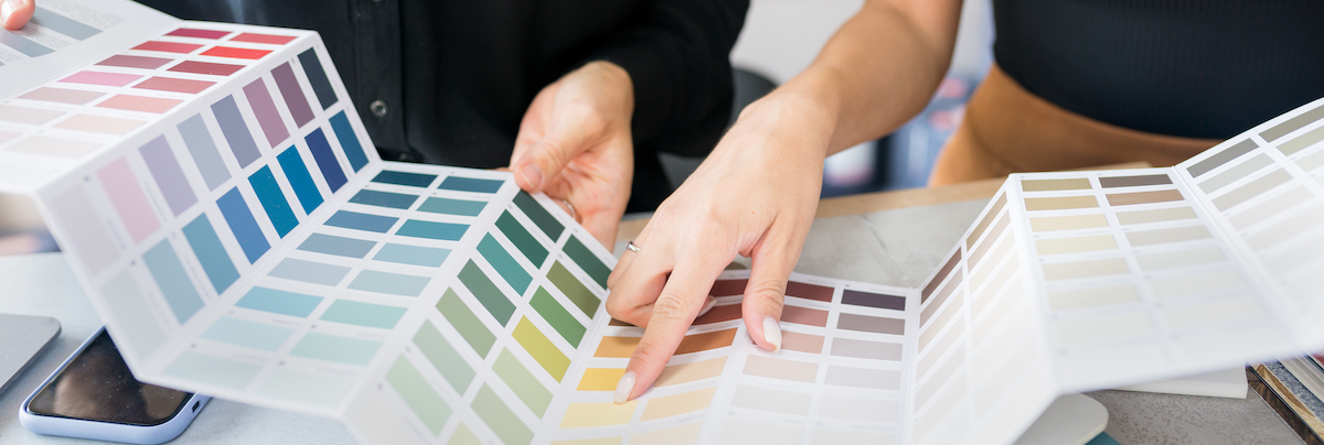 two people picking paint colours