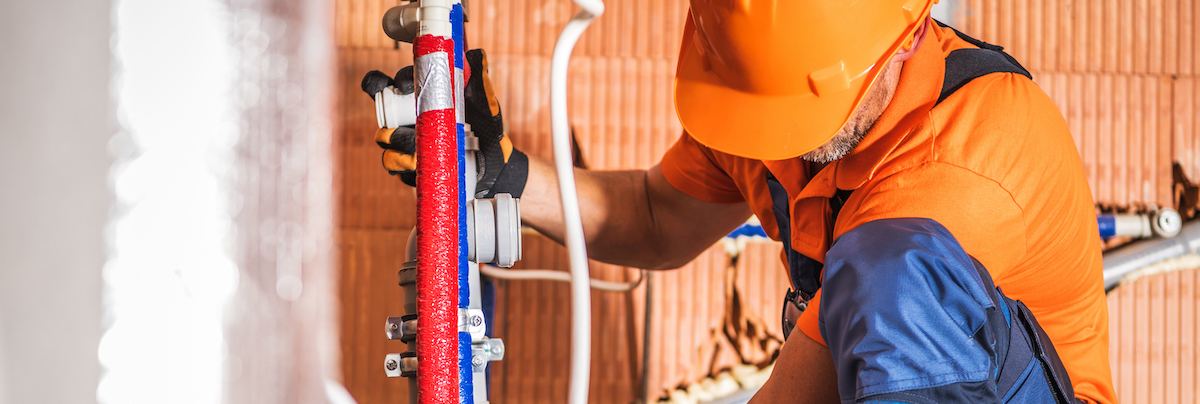 Man fixing pipes
