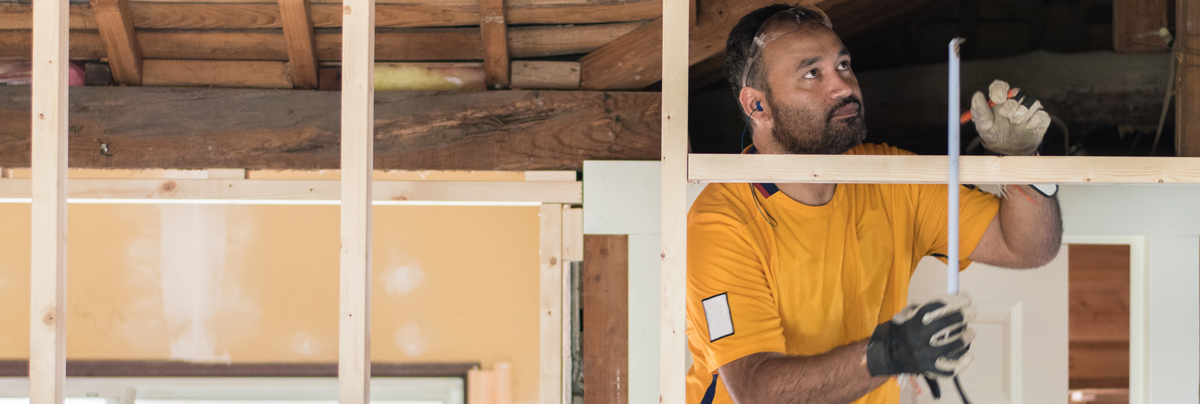 Builder working on house