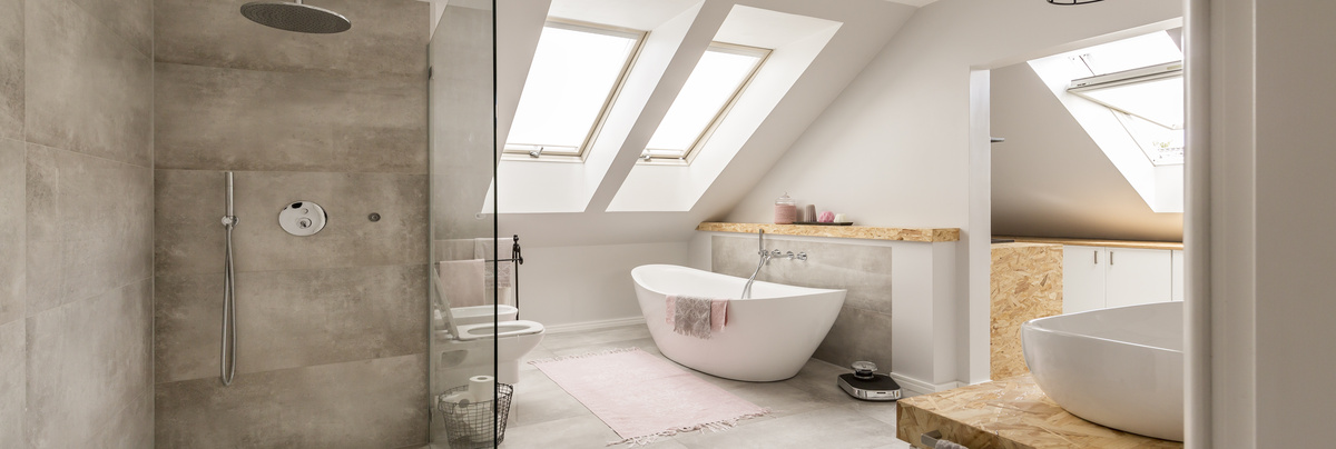 A large bathroom in a newly converted loft space