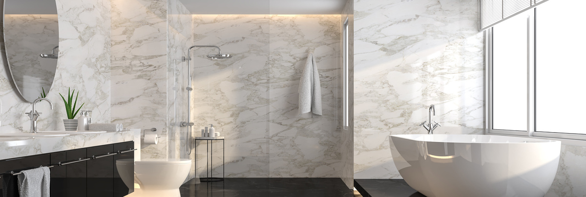 A large bathroom with freestanding bath and walk in shower