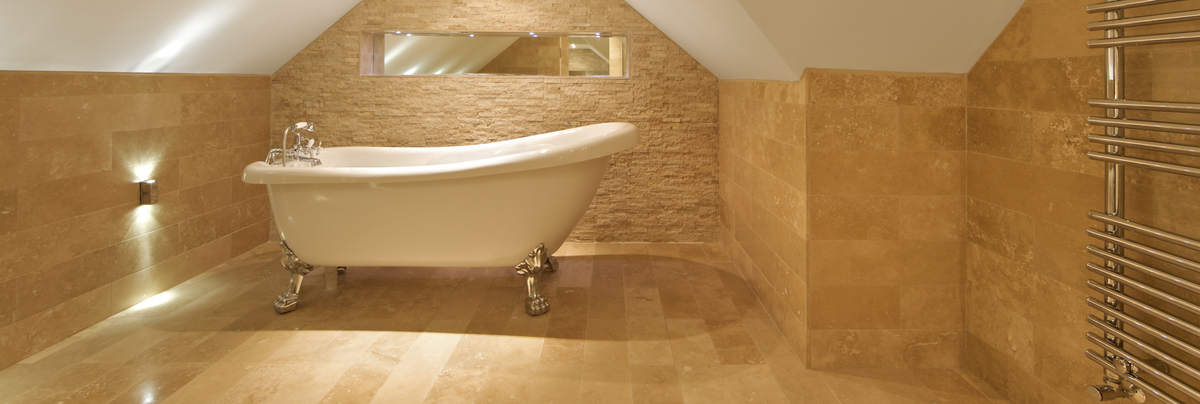 loft bathroom with standalone claw foot bathtub