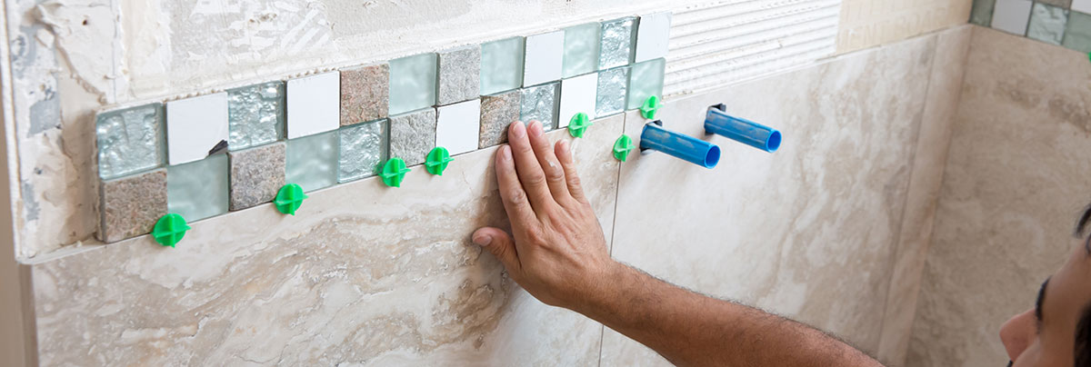 bathrom installer laying tiles