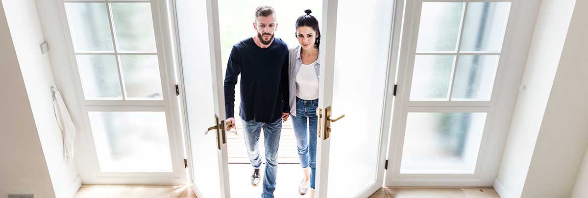 young couple in newly extended home