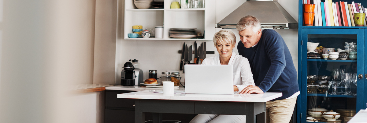 A family looking at plans on a computer