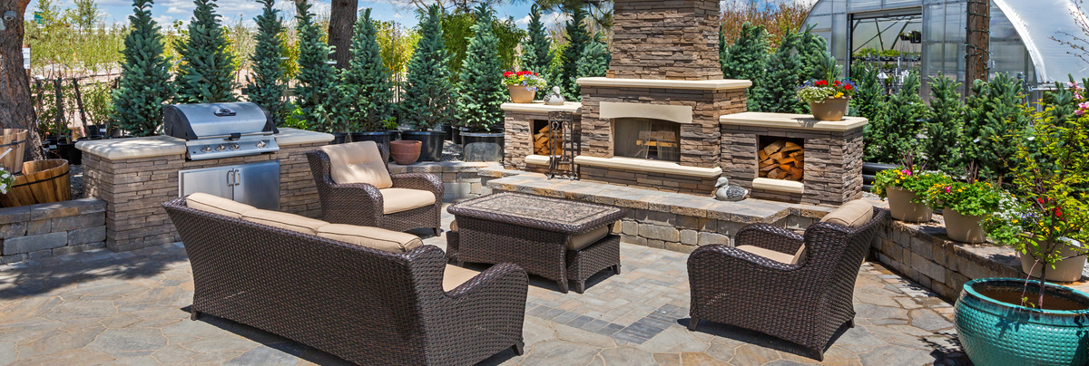 A large outdoor kitchen and seating area