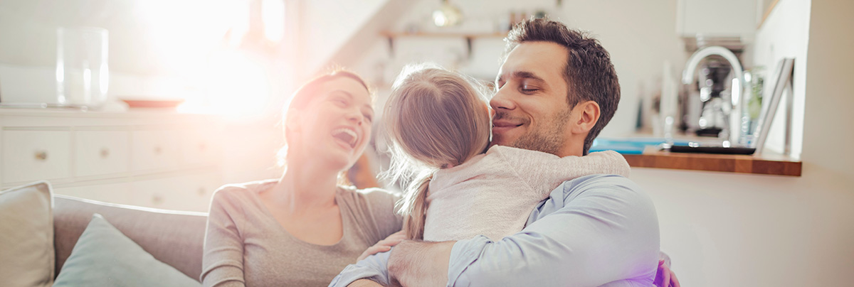 family enjoying natural light in lounge
