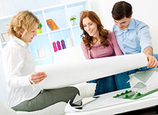 Renovation architect showing house plans to renovators in Surrey
