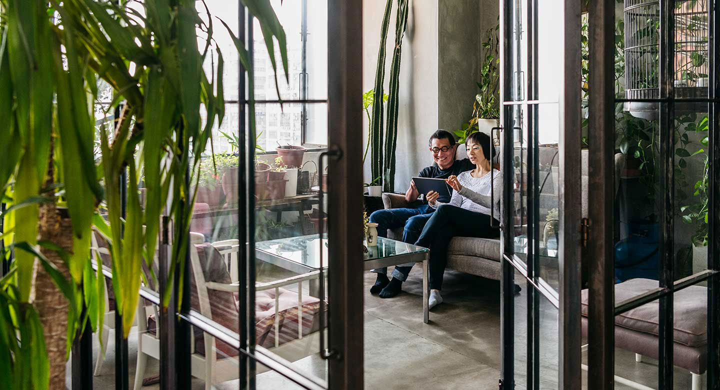 Couple relaxing in conservatory