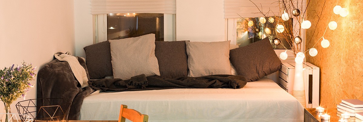 A bedroom with decorating lights