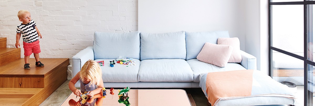 Living room with two kids playing