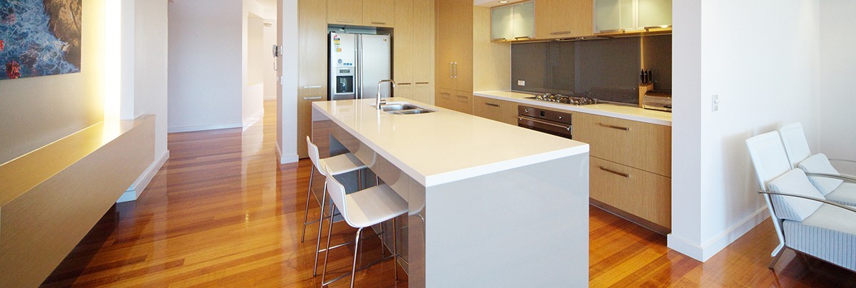 A renovate kitchen with polishes wooden floor