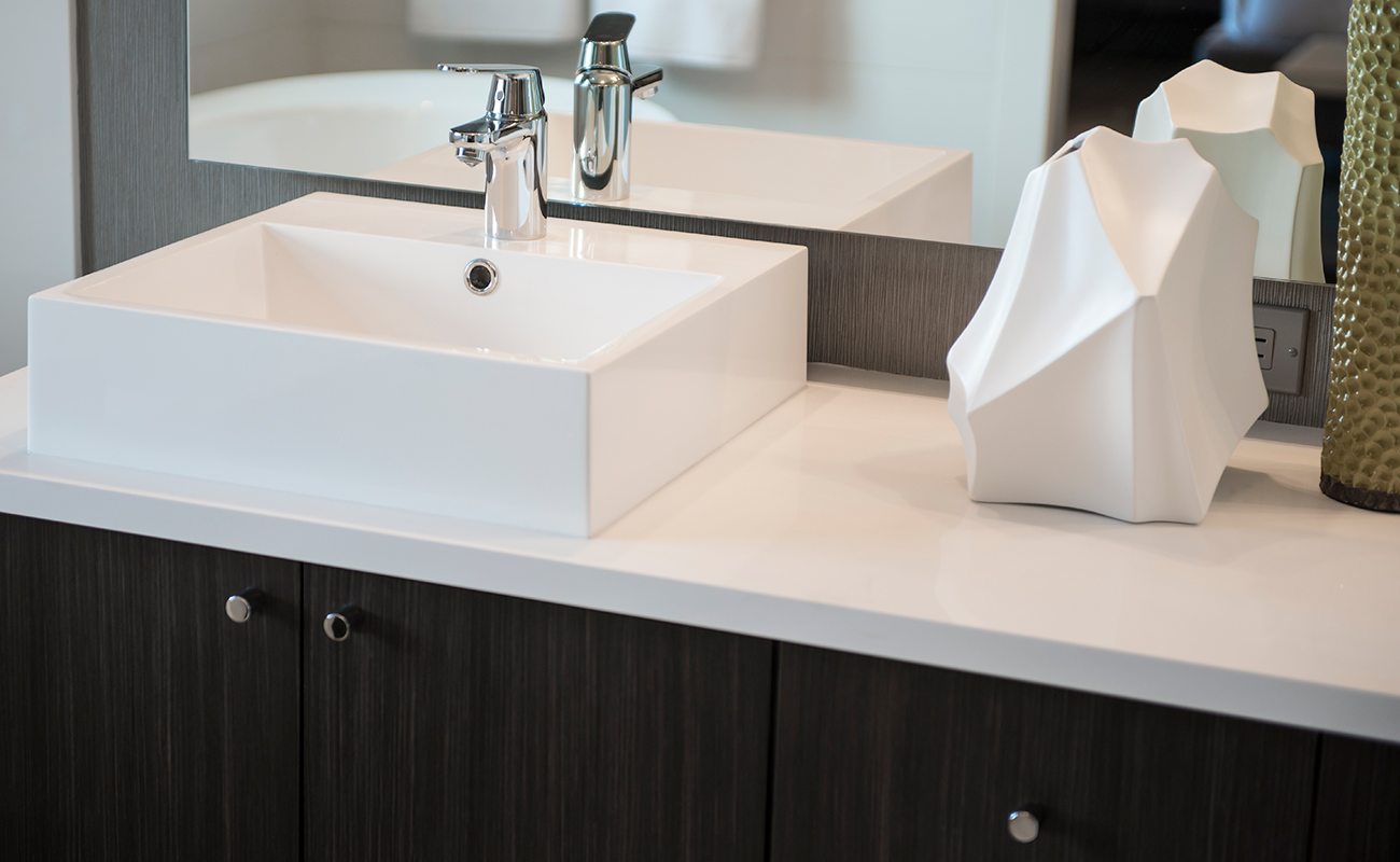 Basic bathroom renovation with floor standing vanity and flat mirror