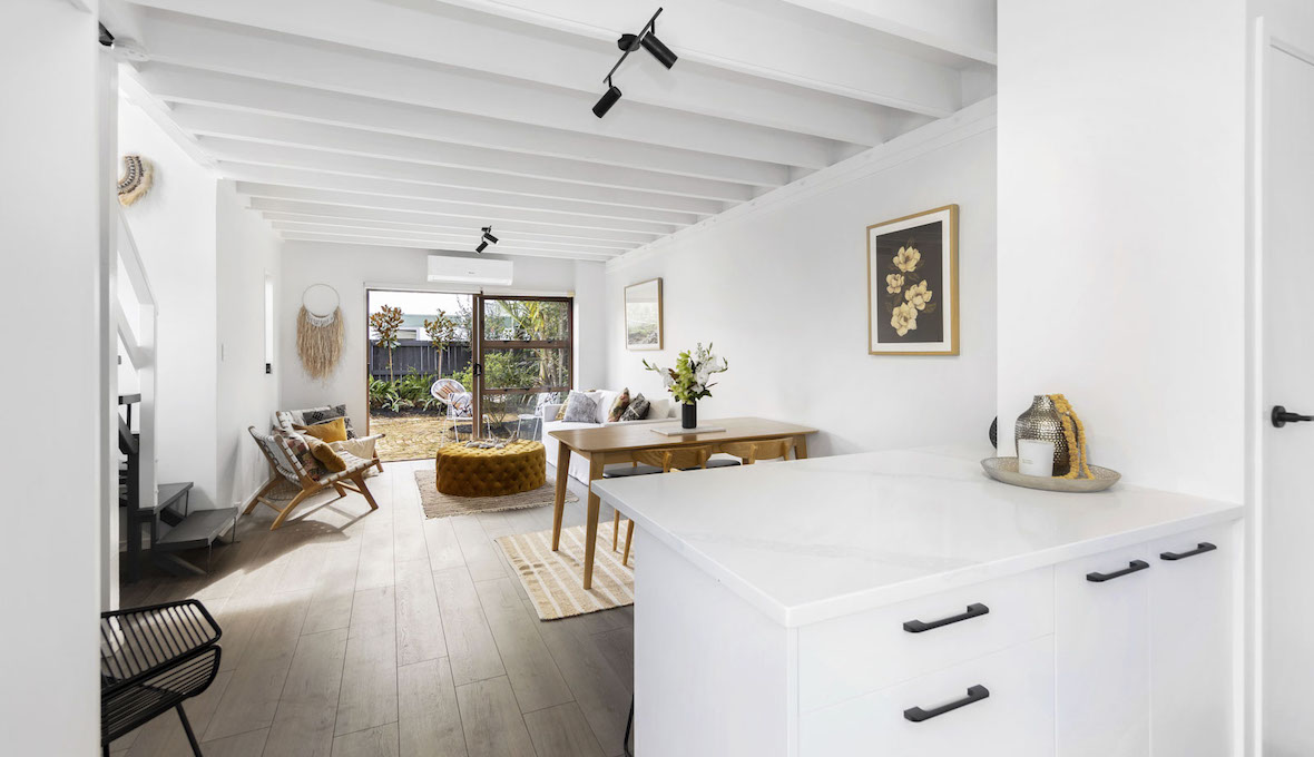 slatted ceiling with dark wooden floor and interior in earthy tones