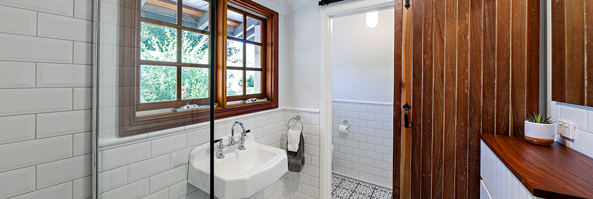 Bathroom renovation with tiles and wood in Perth, Australia.