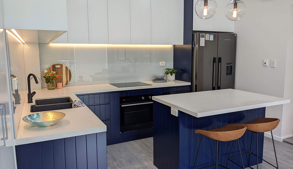 navy kitchen with matching cabinetry 