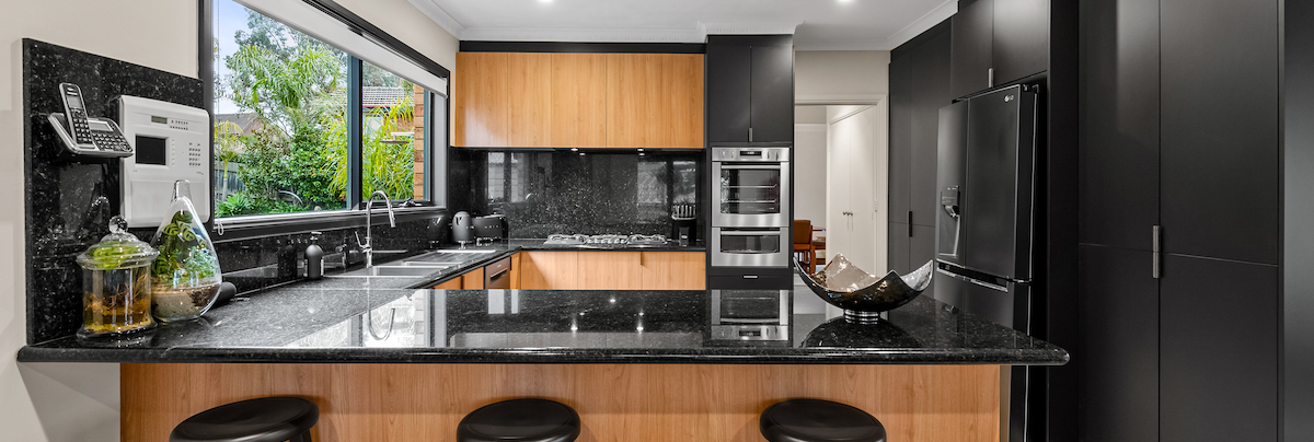 black and wood kitchen renovation